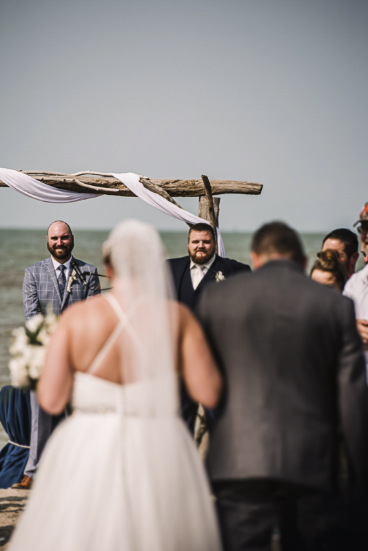 docks-beach-house-groom-seeing-bride