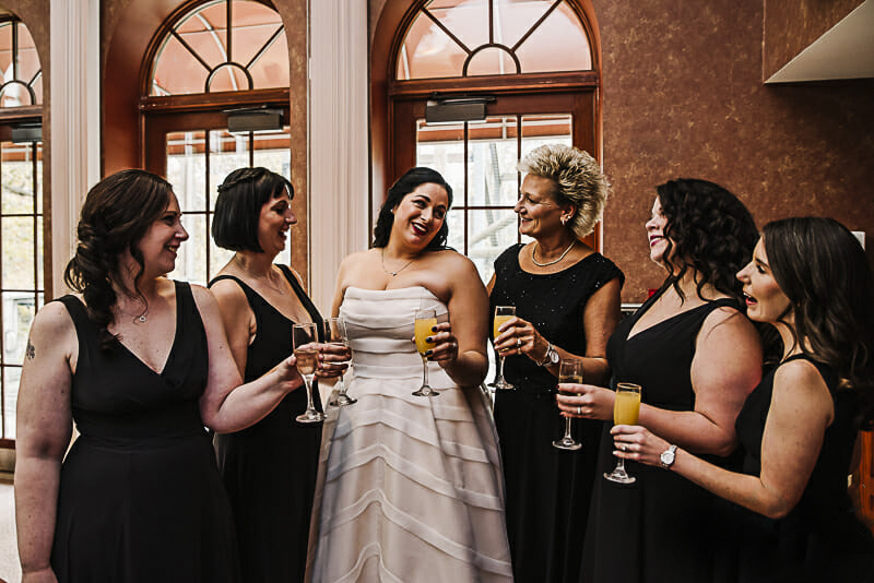 bride-and-her-bridesmaids-champagne-toast-at-toledo-zoo