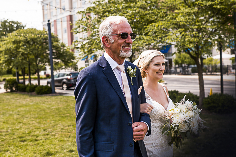 brides-dad-walking-bride-down-the-aisle-at-outdoor-perrysburg-hilton-ceremony