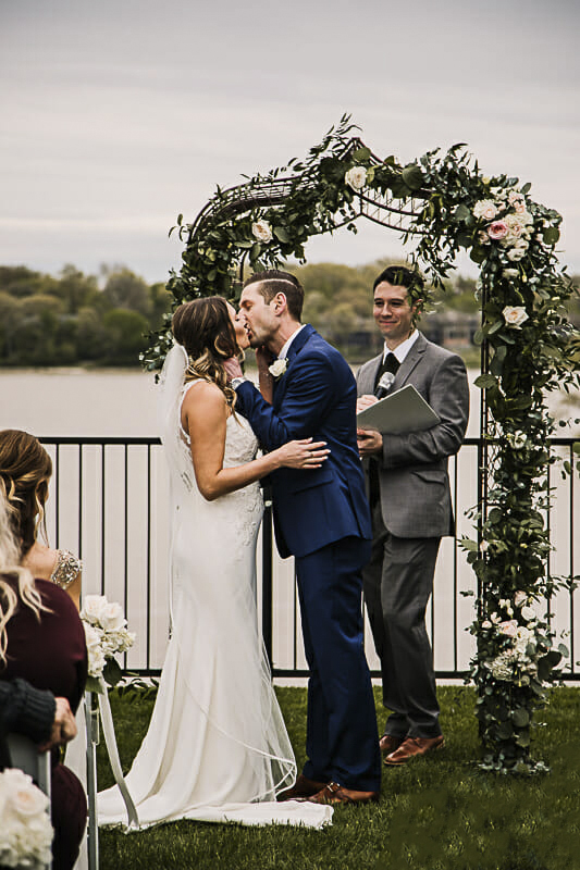 first-kiss-at-outdoor-toledo-country-club-ceremony