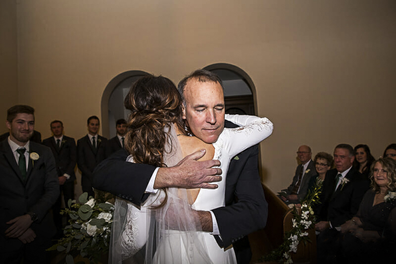 hug-at-nazareth-hall-chapel-wedding